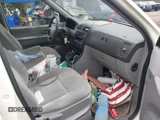 2004 Kia Sedona LX with VIN KNDUP131446493787, listed as a IAAI auction lot 40004348 with 168,374 mi miles. Bid and sale history available at carsss.com. Image 5.