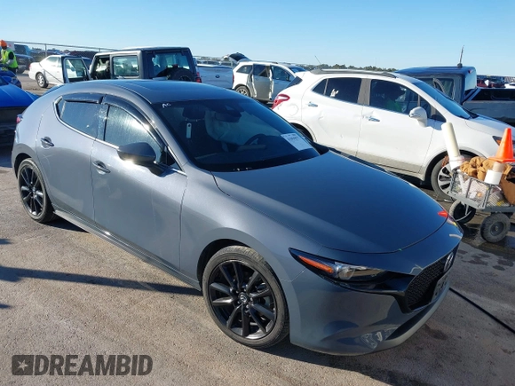 2022 Mazda Mazda3 Hatchback Premium with VIN JM1BPBML8N1520307, listed as a IAAI auction lot 41059877 with 39,497 mi miles. Bid and sale history available at carsss.com. Image 1.