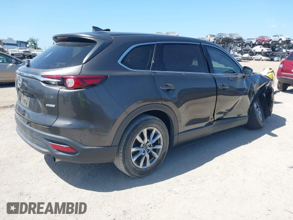 2019 Mazda CX-9 Touring with VIN JM3TCACY9K0304899, listed as a IAAI auction lot 42167180 with 57,043 mi miles and . Bid and sale history available at DreamBid. Image 4.