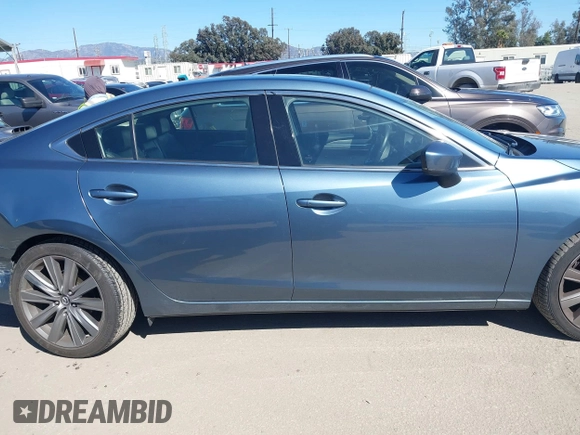 2018 Mazda 6 Grand Touring with VIN JM1GL1TY4J1333021, listed as a IAAI auction lot 41818719 with 56,188 mi miles and . Bid and sale history available at DreamBid. Image 13.