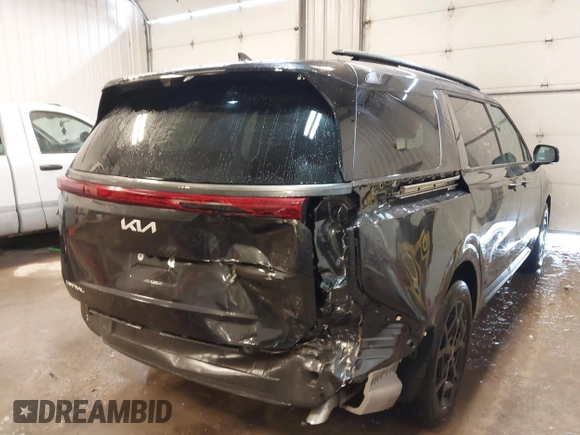 2025 Kia Carnival SX with VIN KNDNE5K33S6467800, listed as a IAAI auction lot 41624780 with 4,456 mi miles and . Bid and sale history available at DreamBid. Image 4.