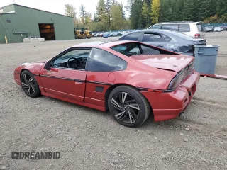 1987 Pontiac Fiero GT z VIN 1G2PG1199HP214795, wystawiony jako Copart lot #75901054 z przebiegiem 206 675 mil mil oraz Szkody całkowita. Historia ofert i sprzedaży dostępna na DreamBid. Obrazek 2.
