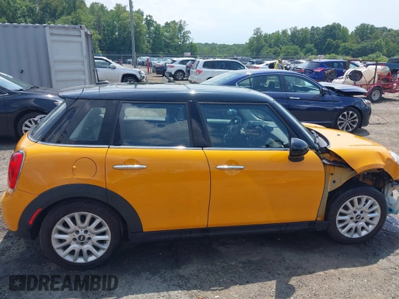 2016 MINI Hardtop 4 Door z VIN WMWXU1C53G2D08424, wystawiony jako IAAI lot #42509304 z przebiegiem 97 729 mil mil oraz . Historia ofert i sprzedaży dostępna na DreamBid. Obrazek 14.