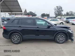 2021 Volkswagen Tiguan S with VIN 3VV1B7AX4MM025586, listed as a IAAI auction lot 41889996 with 21,777 mi miles and . Bid and sale history available at DreamBid. Image 13.
