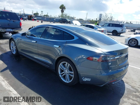 2014 Tesla Model S 60 with VIN 5YJSA1S15EFP29010, listed as a IAAI auction lot 41798180 with 142,754 mi miles and . Bid and sale history available at DreamBid. Image 3.
