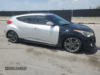 2014 Hyundai Veloster Turbo with VIN KMHTC6AE0EU192680, listed as a Copart auction lot 54486575 with 129,949 mi miles and Clean Title. Bid and sale history available at carsss.com. Image 4.