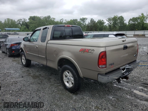 2002 Ford F-150 XL with VIN 1FTRX18L02NA58574, listed as a Copart auction lot 57156255 with 291,950 mi miles and Salvage title. Bid and sale history available at DreamBid. Image 2.