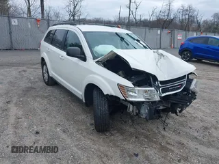 2016 Dodge Journey SE with VIN 3C4PDCAB1GT104630, listed as a IAAI auction lot 41731485 with 233,992 mi miles. Bid and sale history available at carsss.com. Image 1.