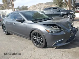 2016 Mazda Mazda6 i Grand Touring with VIN JM1GJ1W57G1441102, listed as a IAAI auction lot 41687057 with 144,876 mi miles. Bid and sale history available at carsss.com. Image 1.