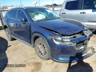 2019 Mazda CX-5 Touring with VIN JM3KFACM7K1654347, listed as a IAAI auction lot 41473542 with 101,297 mi miles. Bid and sale history available at carsss.com. Image 1.