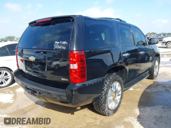 2011 Chevrolet Tahoe LS with VIN 1GNSCAE05BR380084, listed as a IAAI auction lot 42746873 with 386,755 mi miles and . Bid and sale history available at DreamBid. Image 4.
