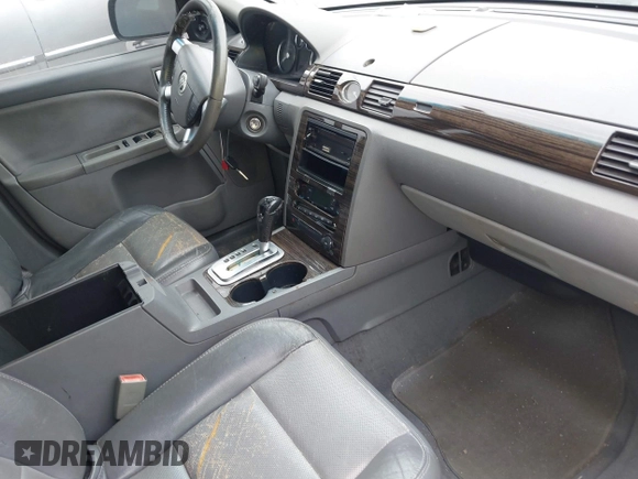 2006 Mercury Montego Luxury z VIN 1MEFM40166G617559, wystawiony jako IAAI lot #41768007 z przebiegiem 234 542 mil mil oraz . Historia ofert i sprzedaży dostępna na DreamBid. Obrazek 5.