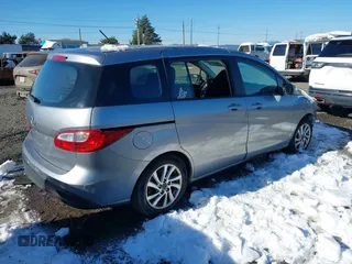2014 Mazda 5 Sport with VIN JM1CW2BLXE0168119, listed as a IAAI auction lot 41527688 with 142,357 mi miles and . Bid and sale history available at DreamBid. Image 4.