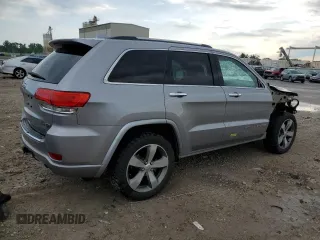 2015 Jeep Grand Cherokee High Altitude with VIN 1C4RJFCG2FC196563, listed as a Copart auction lot 56302315 with 143,759 mi miles and Salvage title. Bid and sale history available at DreamBid. Image 3.