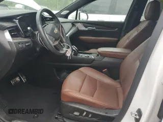 2023 Cadillac XT5 AWD Sport with VIN 1GYKNGRS4PZ176086, listed as a Copart auction lot 53955535 with 15,709 mi miles and Salvage title. Bid and sale history available at DreamBid. Image 7.