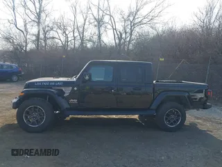 2021 Jeep Gladiator Overland z VIN 1C6HJTFG1ML606215, wystawiony jako IAAI lot #41771646 z przebiegiem 77 411 mil mil oraz . Historia ofert i sprzedaży dostępna na DreamBid. Obrazek 14.