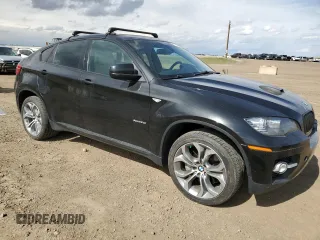 2012 BMW X6 50i z VIN 5UXFG8C59CLZ97450, wystawiony jako Copart lot #55281205 z przebiegiem 188 625 mil mil oraz Czysty tytuł • Clean title. Historia ofert i sprzedaży dostępna na DreamBid. Obrazek 4.