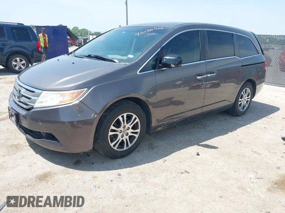 2012 Honda Odyssey EX with VIN 5FNRL5H41CB011940, listed as a IAAI auction lot 42033966 with 182,996 mi miles and . Bid and sale history available at DreamBid. Image 2.