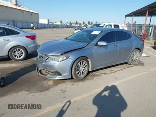 2016 Acura TLX with VIN 19UUB1F38GA002104, listed as a IAAI auction lot 41998966 with 124,159 mi miles. Bid and sale history available at carsss.com. Image 2.
