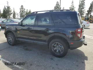 2023 Ford Bronco Sport Badlands z VIN 3FMCR9D97PRD35830, wystawiony jako Copart lot #56950865 z przebiegiem 7 401 mil mil oraz Szkoda całkowita • Salvage title. Historia ofert i sprzedaży dostępna na DreamBid. Obrazek 2.