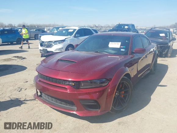 2022 Dodge Charger Scat Pack with VIN 2C3CDXGJ6NH216788, listed as a IAAI auction lot 41670744 with 48,680 mi miles and . Bid and sale history available at carsss.com. Image 17.