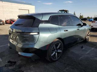 2023 BMW iX xDrive50 with VIN WB523CF03PCM54871, listed as a Copart auction lot 45988445 with 21,056 mi miles and Salvage Title. Bid and sale history available at carsss.com. Image 3.