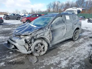 2017 Toyota RAV4 LE with VIN JTMZFREV9HJ119332, listed as a IAAI auction lot 41257790 with 94,992 mi miles and . Bid and sale history available at carsss.com. Image 2.