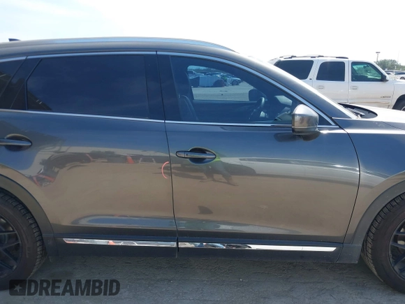 2016 Mazda CX-9 Grand Touring with VIN JM3TCADY5G0120033, listed as a IAAI auction lot 42248488 with 150,044 mi miles and . Bid and sale history available at DreamBid. Image 14.