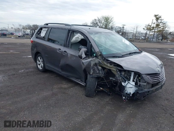 2015 Toyota Sienna LE AAS with VIN 5TDKK3DC1FS615090, listed as a IAAI auction lot 41965112 with 116,745 mi miles. Bid and sale history available at carsss.com. Image 1.