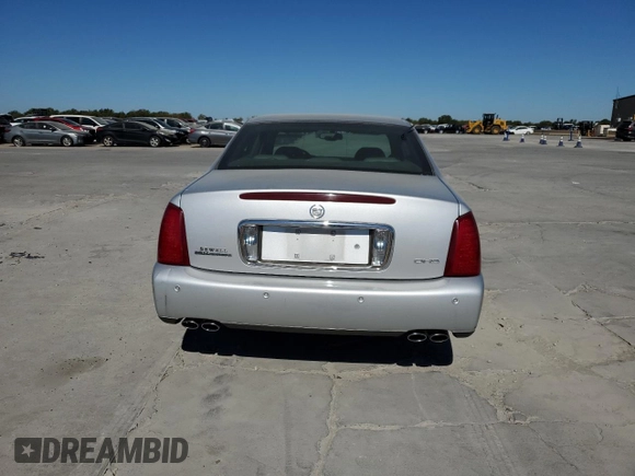 2003 Cadillac DeVille DHS z VIN 1G6KE54Y13U124690, wystawiony jako Copart lot #73757984 z przebiegiem 101 286 mil mil oraz Szkoda całkowita • Salvage title. Historia ofert i sprzedaży dostępna na DreamBid. Obrazek 6.