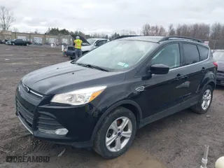 2016 Ford Escape SE with VIN 1FMCU9G97GUB49000, listed as a IAAI auction lot 41797005 with 104,690 mi miles. Bid and sale history available at carsss.com. Image 2.