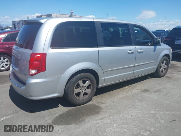 2012 Dodge Grand Caravan SXT with VIN 2C4RDGCG7CR204835, listed as a IAAI auction lot 41948688 with 125,466 mi miles and . Bid and sale history available at DreamBid. Image 4.
