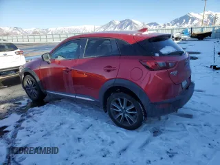 2016 Mazda CX-3 Grand Touring with VIN JM1DKBD78G0113185, listed as a Copart auction lot 42802145 with 158,068 mi miles and Salvage Title. Bid and sale history available at DreamBid. Image 2.