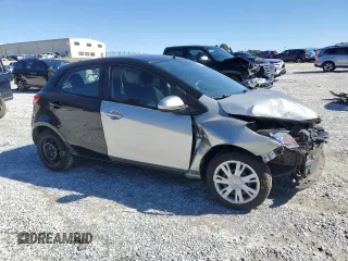 2012 Mazda 2 Sport with VIN JM1DE1KZ2C0149132, listed as a Copart auction lot 45177385 with 146,966 mi miles and Salvage Title. Bid and sale history available at DreamBid. Image 4.
