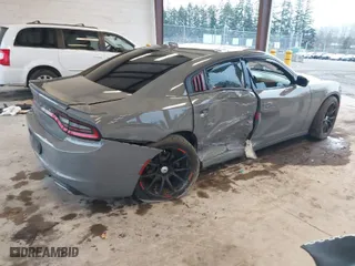 2019 Dodge Charger SXT with VIN 2C3CDXJG2KH547683, listed as a IAAI auction lot 41232974 with 75,960 mi miles. Bid and sale history available at carsss.com. Image 4.