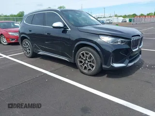 2023 BMW X1 xDrive28i with VIN WBX73EF03P5W15295, listed as a IAAI auction lot 42071192 with 23,326 mi miles. Bid and sale history available at carsss.com. Image 1.