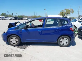 2009 Honda Fit with VIN JHMGE88249S056575, listed as a IAAI auction lot 41702555 with 116,658 mi miles. Bid and sale history available at carsss.com. Image 14.