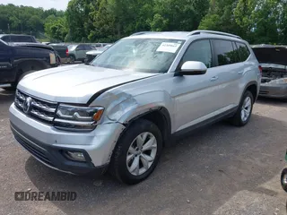 2018 Volkswagen Atlas SE z VIN 1V2DR2CAXJC521412, wystawiony jako IAAI lot #42309661 z przebiegiem 99 045 mil mil oraz . Historia ofert i sprzedaży dostępna na DreamBid. Obrazek 2.