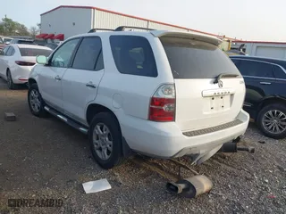 2005 Acura MDX Touring with VIN 2HNYD18665H558857, listed as a IAAI auction lot 41829809 with 157,147 mi miles. Bid and sale history available at carsss.com. Image 3.