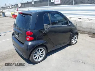 2014 Smart fortwo Pure with VIN WMEEJ3BA1EK752202, listed as a IAAI auction lot 42672207 with 65,736 mi miles and . Bid and sale history available at DreamBid. Image 4.