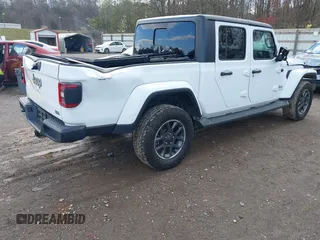 2020 Jeep Gladiator Overland with VIN 1C6HJTFG1LL107641, listed as a IAAI auction lot 41847586 with 69,664 mi miles and . Bid and sale history available at DreamBid. Image 4.