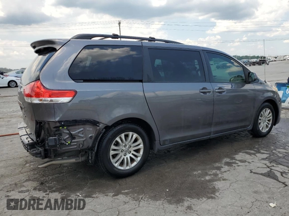 2014 Toyota Sienna XLE with VIN 5TDYK3DC6ES456558, listed as a Copart auction lot 63106085 with 231,260 mi miles and Salvage title. Bid and sale history available at DreamBid. Image 3.
