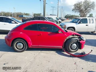2012 Volkswagen Beetle 2.5L with VIN 3VWJX7AT5CM648739, listed as a IAAI auction lot 41547850 with 214,941 mi miles. Bid and sale history available at carsss.com. Image 13.