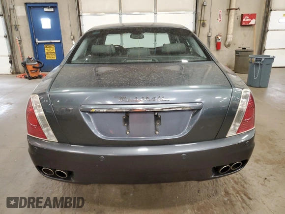 2005 Maserati Quattroporte z VIN ZAMCE39A350017390, wystawiony jako Copart lot #72455664 z przebiegiem 50 394 mil mil oraz Szkoda całkowita • Salvage title. Historia ofert i sprzedaży dostępna na DreamBid. Obrazek 6.