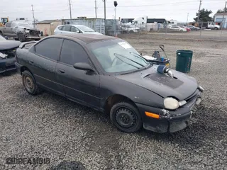 1999 Dodge Neon Competition with VIN 1B3ES47C9XD111397, listed as a IAAI auction lot 41702657 with 210,033 mi miles. Bid and sale history available at carsss.com. Image 1.
