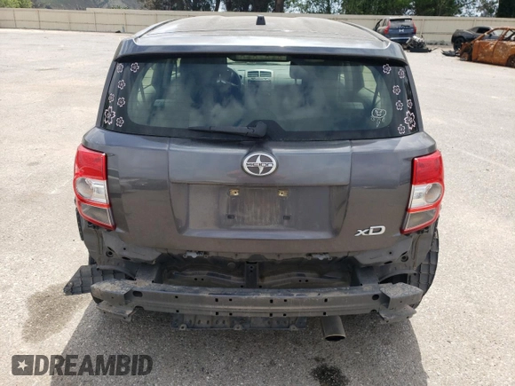 2014 Scion xD with VIN JTKKUPB41E1046114, listed as a Copart auction lot 54599235 with 125,979 mi miles and Salvage title. Bid and sale history available at DreamBid. Image 6.