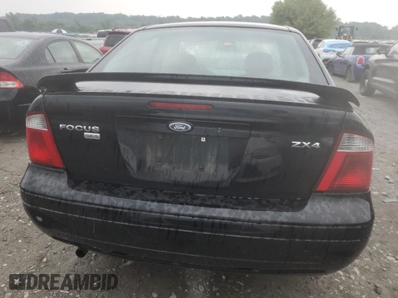 2005 Ford Focus S with VIN 1FAFP34N45W285454, listed as a Copart auction lot 59043485 with 165,071 mi miles and Salvage title. Bid and sale history available at DreamBid. Image 6.