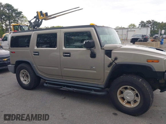 2003 Hummer H2 with VIN 5GRGN23U73H142389, listed as a IAAI auction lot 42219627 with 78,547 mi miles. Bid and sale history available at carsss.com. Image 13.