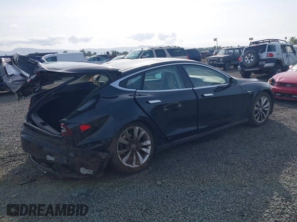 2014 Tesla Model S 60 with VIN 5YJSA1H12EFP53787, listed as a IAAI auction lot 42279493 with 168,859 mi miles and . Bid and sale history available at DreamBid. Image 4.