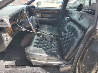 1984 Cadillac Seville z VIN 1G6AS6988EE829387, wystawiony jako Copart lot #75061224 z przebiegiem 643 mil mil oraz Szkody całkowita. Historia ofert i sprzedaży dostępna na DreamBid. Obrazek 7.